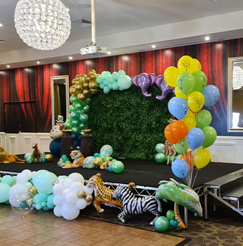 A festive party room filled with colorful balloons and decorations for a Birthday Party event at Seasons5